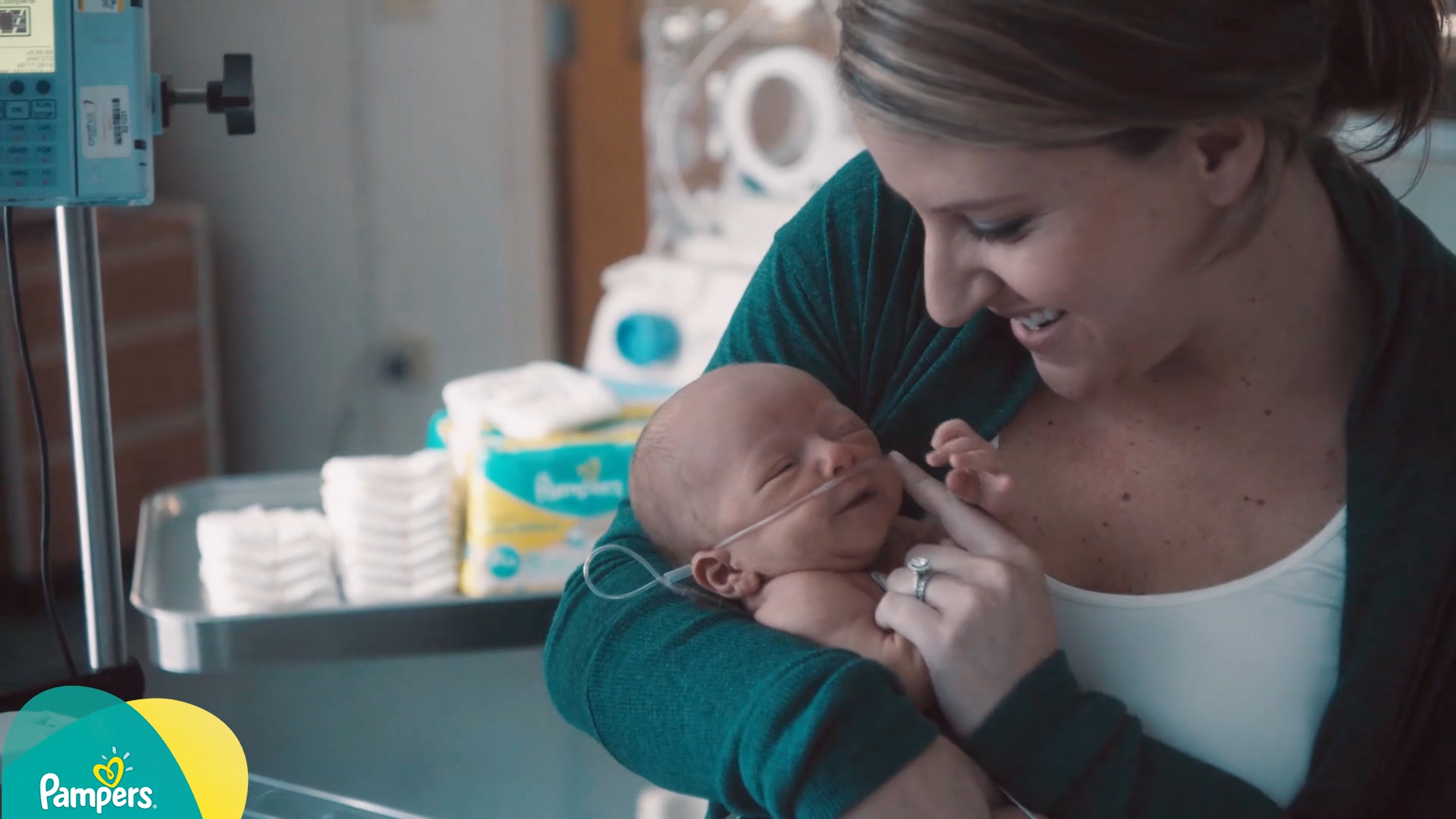 Lady holding premature baby